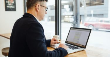 man using macbook