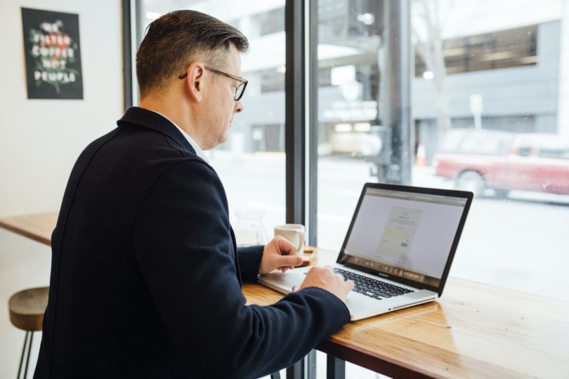 man using macbook