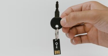 close up shot of a person holding a key