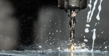 close up phot of a cnc milling machine with metalworking fluid