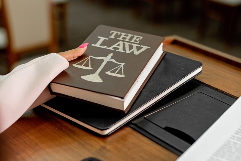 a person holding a the law book