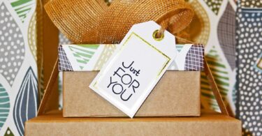 close up photo of gift boxes with greeting card