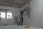 man painting the wall