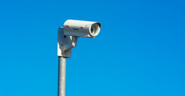 photo of a cctv camera against the blue sky