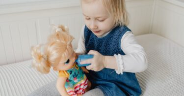 girl playing with her doll