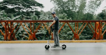 man riding on bird electric scooter