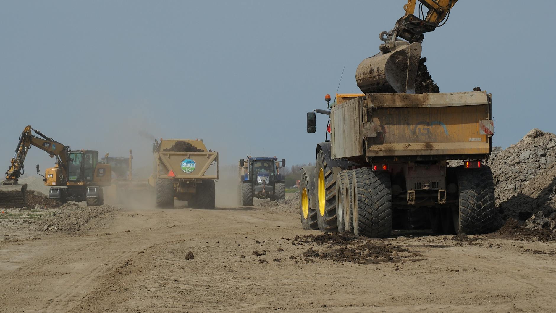 heavy machinery at construction site moving earth