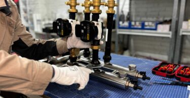 engineer assembling industrial heating unit