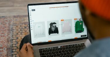 person looking on the clothes online