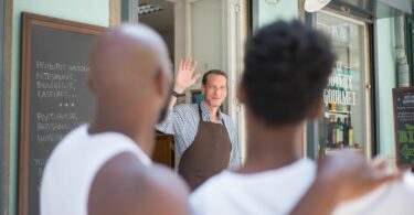 a store clerk waving goodbye