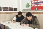 students studying in classroom with london theme